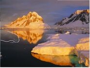 Geoff-renner-iceberg-lit-by-midnight-sun-antarctic-peninsula-antarctica