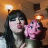 Lucy holding the Portals Parfums statue