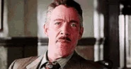 A scene from Spider-Man 2 with J. Jonah Jameson laughing towards Peter Parker, which later served as inspiration for the character.