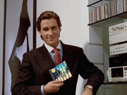 Patrick Bateman Holding an Album - primer meme
