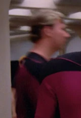 In a corridor Played by an unknown actor (TNG: "The Big Goodbye")
