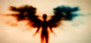 Red angel blurry, DIS opening title.jpg (93 KB) The mysterious Red Angel figure (out of focus)