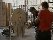 Model makers from Image G prepare a breakaway model of the USS Saratoga for destruction
