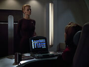 Janeway and Seven discuss the detection of Omega
