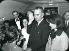Lyndon B Johnson taking the oath of office