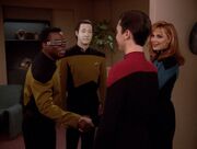 Geordi La Forge and Data greet Wesley Crusher