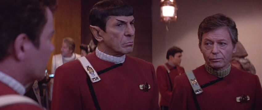 Kirk Spock and McCoy at the party.jpg