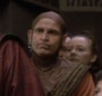 Bajoran monk supporting Winn