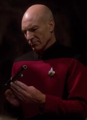 Picard inspecting a Colt 45