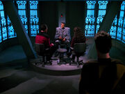 Riker and Troi interrogate Jarok