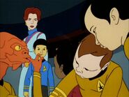 Sarah April and young Spock overlook the infantile Arex, Uhura, Kirk and Sulu