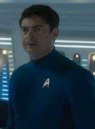 Leonard McCoy of the alternate reality USS Enterprise in sciences blue, 2263