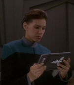 Human DS9 Starfleet medical officer with PADD