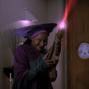 Guinan firing her Magus III energy weapon