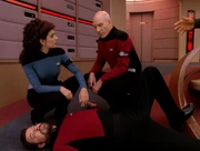 Troi and Picard find Riker frozen in time