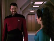 Riker smiling at Troi