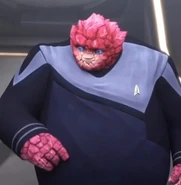 Rok-Tahk in Starfleet uniform.jpg (36 KB) Rok-Tahk in the crewman's variant uniform worn on the Protostar