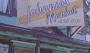 Johnnies Market sign