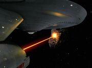 USS Enterprise fires deflector beam