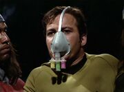 Kirk wearing filter mask