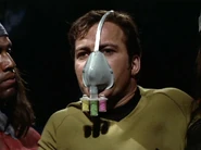 Kirk wearing filter mask.jpg (55 KB) Kirk wearing mask to prevent inhalation of zenite gas