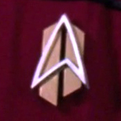 Starfleet combadge (mid-2380s)