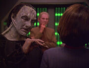 Elim Garak adjusting Kira's Starfleet uniform