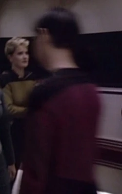 In a corridor Played by an unknown actor (TNG: "Angel One")