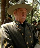 Colonel Q Played by Harve Presnell