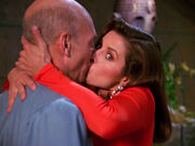 Vash distracts Picard with a kiss