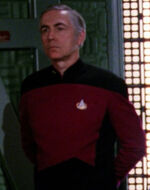 Command division officer in transporter room, 2366