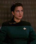 Jadzia Dax wearing the greener sciences division dress uniform in 2372