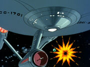 USS Enterprise nearly misses an exploding asteroid