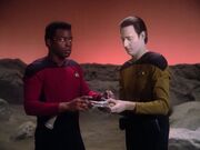 Data helps Geordi La Forge with VISOR