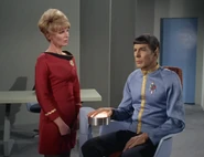Shaw questions Spock.jpg (141 KB) A sciences division commander and an operations division lieutenant in dress uniforms (2267)