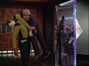 Worf carries Data through portal