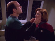 The Doctor examines Janeway