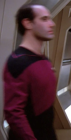In a corridor Played by an unknown actor (TNG: "The Neutral Zone")