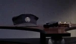 Pike's service cap and phaser