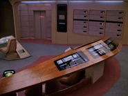 The station is integrated into a wooden rail behind the command chairs on a Galaxy-class ship...