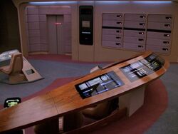 The station is integrated into a wooden rail behind the command chairs on a Galaxy-class ship...
