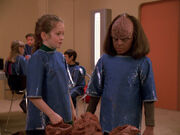 Clara and Alexander wearing dirty smocks