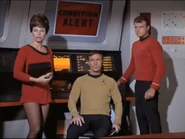 An ensign, Hadley and Leslie on the bridge in 2268