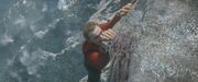 Scotty hanging off a cliff