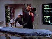 Riker delivers Troi to sickbay