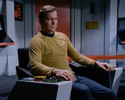 Kirk in Enterprise command chair