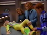 Eric brings an injured Annette to sickbay