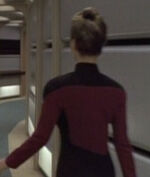 Female command division officer in corridor, 2368