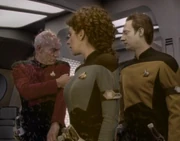 Three modified armbands in use, worn on one's left arm