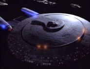 The USS Enterprise-D powers up its dorsal phaser array